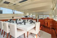 Luxurious dining area on a 2007 Codecasa 41S yacht with elegant table setting.