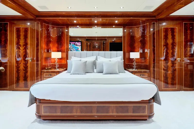Ability Yacht Photos Pics Luxurious bedroom interior on Codecasa 41S yacht, featuring elegant wood paneling and modern decor.