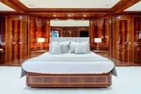 Luxurious bedroom interior on Codecasa 41S yacht, featuring elegant wood paneling and modern decor.