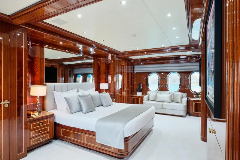 Ability Yacht Photos Pics Luxurious bedroom interior on 2007 Codecasa 41S yacht with elegant wood paneling.