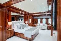 Luxurious bedroom interior on 2007 Codecasa 41S yacht with elegant wood paneling.
