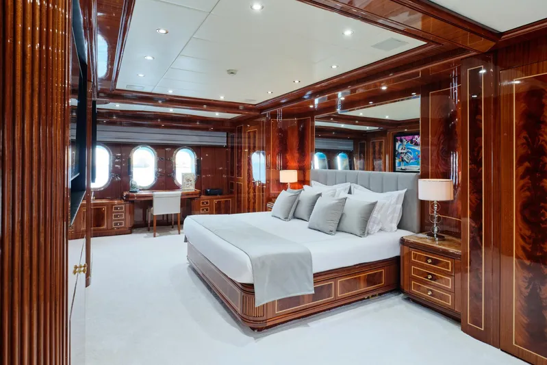 Ability Yacht Photos Pics Luxurious bedroom interior on 2007 Codecasa 41S yacht with elegant wood paneling.