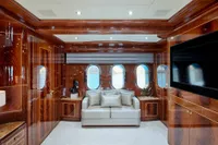 Luxurious interior of 2007 Codecasa 41S yacht with elegant wood paneling and plush seating.