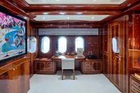 Luxurious yacht office interior with wood paneling, desk, and porthole windows on Codecasa 41S, 2007.