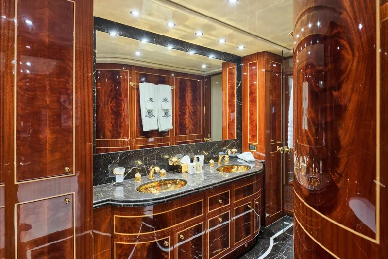 Ability Yacht Photos Pics Luxurious yacht bathroom with wood paneling, marble countertops, and gold fixtures, Codecasa 41S, 2007.
