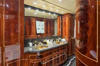 Luxurious yacht bathroom with wood paneling, marble countertops, and gold fixtures, Codecasa 41S, 2007.