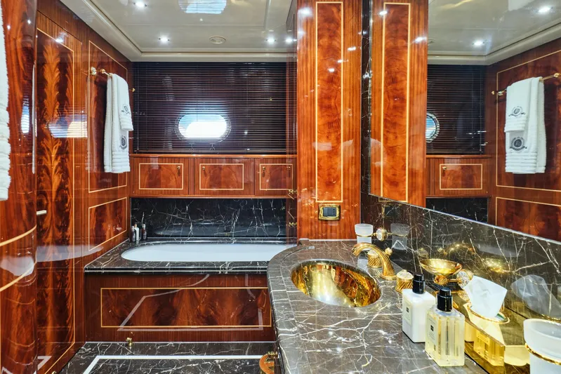 Ability Yacht Photos Pics Luxurious bathroom in 2007 Codecasa 41S yacht with marble and wood finishes.