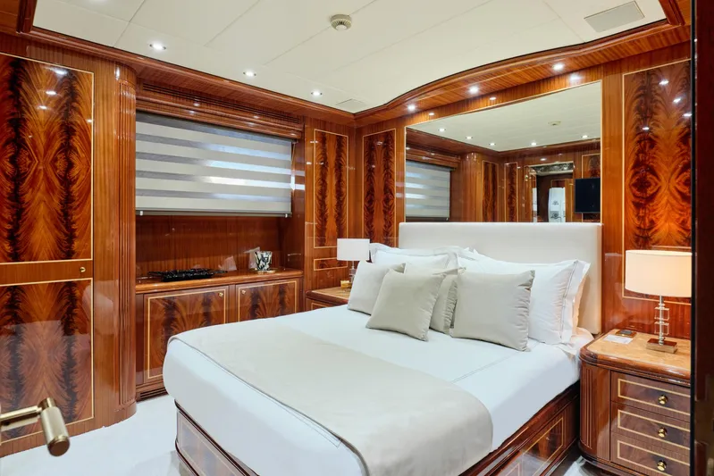 Ability Yacht Photos Pics Luxurious bedroom interior on 2007 Codecasa 41S yacht, featuring elegant wood paneling and modern decor.