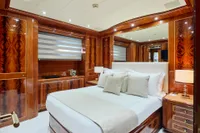 Luxurious bedroom interior on 2007 Codecasa 41S yacht, featuring elegant wood paneling and modern decor.