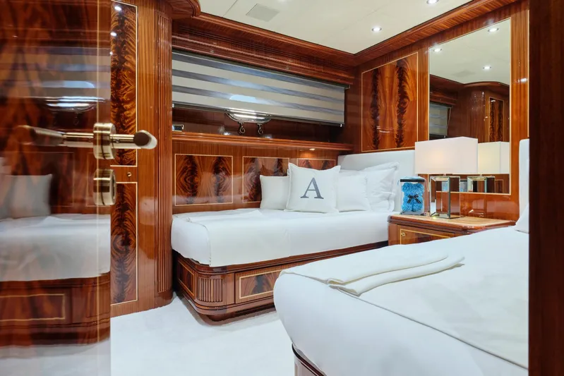 Ability Yacht Photos Pics Luxurious bedroom interior on 2007 Codecasa 41S yacht with elegant wood paneling and plush bedding.