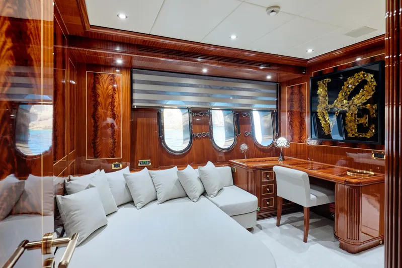 Ability Yacht Photos Pics Luxurious interior of 2007 Codecasa 41S yacht with elegant wood paneling and plush seating.