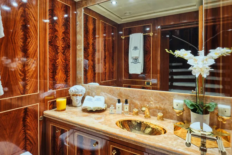 Ability Yacht Photos Pics Luxurious yacht bathroom with wood paneling, marble countertop, and gold fixtures, Codecasa 41S, 2007.