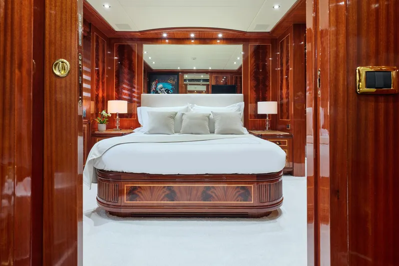 Ability Yacht Photos Pics Luxurious bedroom interior on 2007 Codecasa 41S yacht with elegant wood paneling.