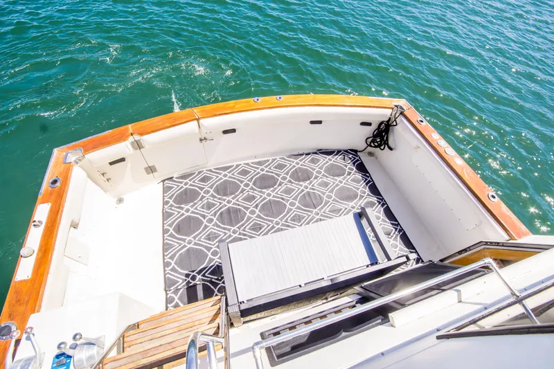 Coda Yacht Photos Pics 1989 Californian 55 Cockpit Motor Yacht with spacious deck and ocean view.