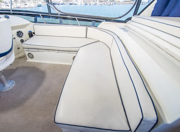 Coda Yacht Photos Pics 1989 Californian 55 Cockpit Motor Yacht interior with white seating and ocean view.