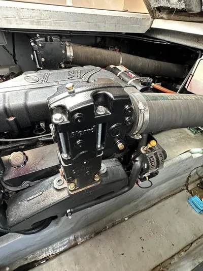 No Tan Lines Yacht Photos Pics Engine compartment of a 2000 Sea Ray 410 Sundancer boat, showcasing mechanical components.