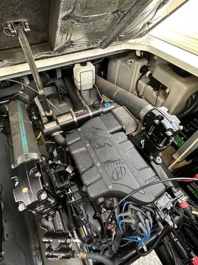 No Tan Lines Yacht Photos Pics Engine compartment of a 2000 Sea Ray 410 Sundancer boat, showcasing mechanical components.