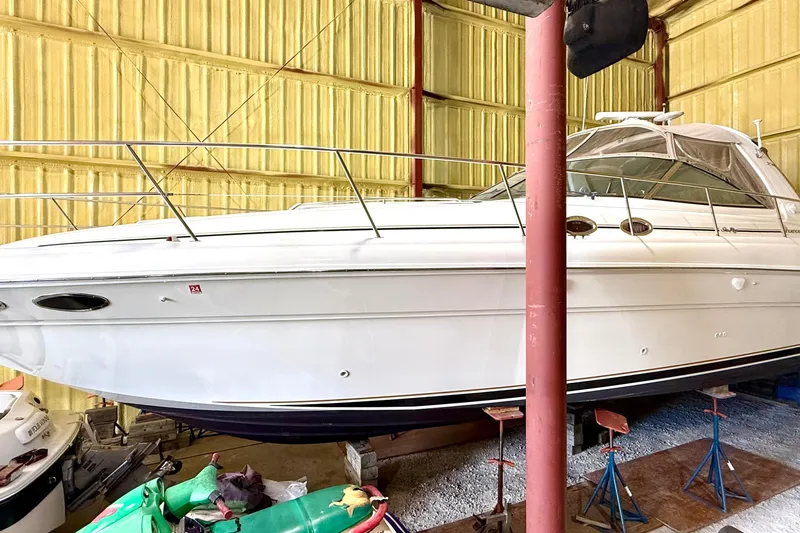 No Tan Lines Yacht Photos Pics 2000 Sea Ray 410 Sundancer yacht in storage, side view, indoors.