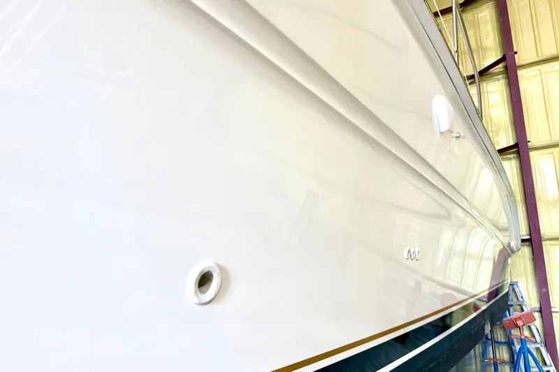 No Tan Lines Yacht Photos Pics Side view of a 2000 Sea Ray 410 Sundancer yacht in a storage facility.