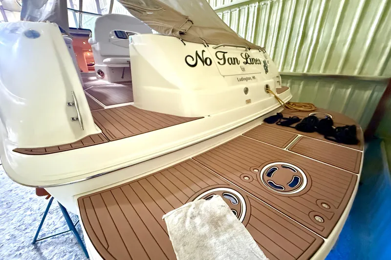 No Tan Lines Yacht Photos Pics 2000 Sea Ray 410 Sundancer boat with teak deck, docked indoors.