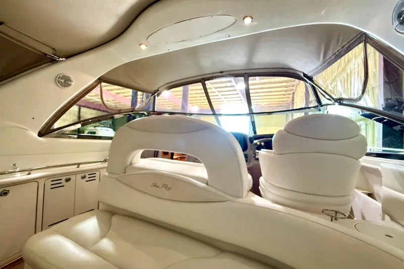 No Tan Lines Yacht Photos Pics Interior of 2000 Sea Ray 410 Sundancer yacht with luxurious white seating.