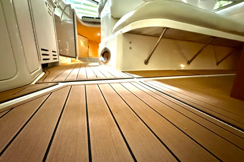 No Tan Lines Yacht Photos Pics Interior view of 2000 Sea Ray 410 Sundancer with sleek wooden flooring.