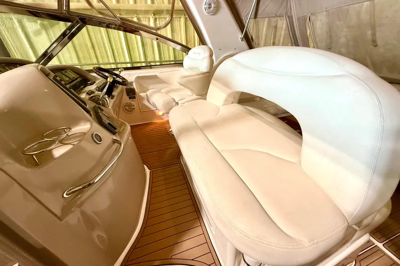 No Tan Lines Yacht Photos Pics Interior of 2000 Sea Ray 410 Sundancer with plush seating and wooden flooring.