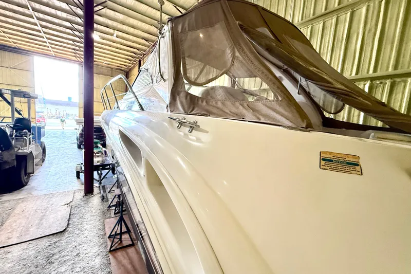 No Tan Lines Yacht Photos Pics 2000 Sea Ray 410 Sundancer yacht in storage, side view with protective cover.