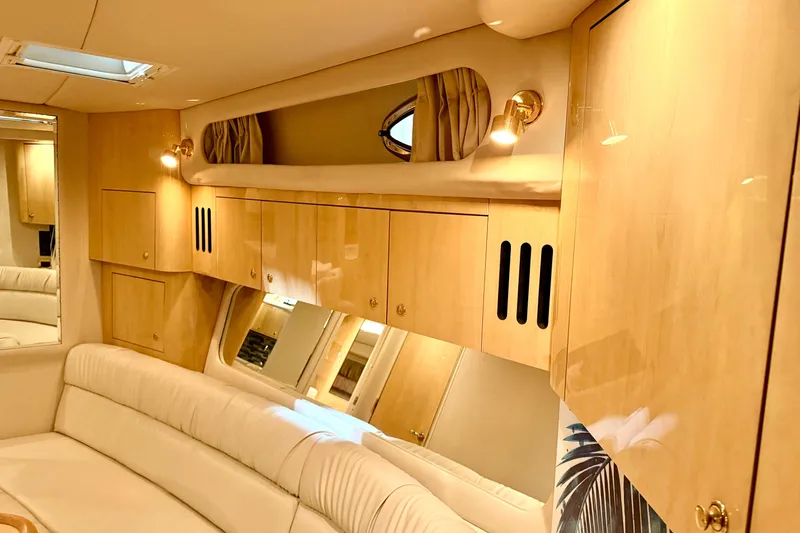 No Tan Lines Yacht Photos Pics Luxurious interior of 2000 Sea Ray 410 Sundancer yacht with elegant wood cabinetry.