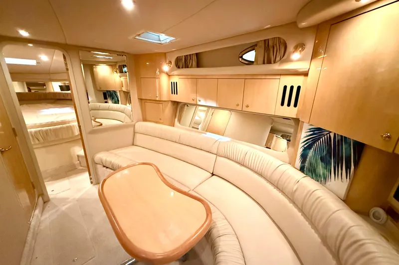 No Tan Lines Yacht Photos Pics Luxurious interior of 2000 Sea Ray 410 Sundancer yacht with plush seating and elegant decor.