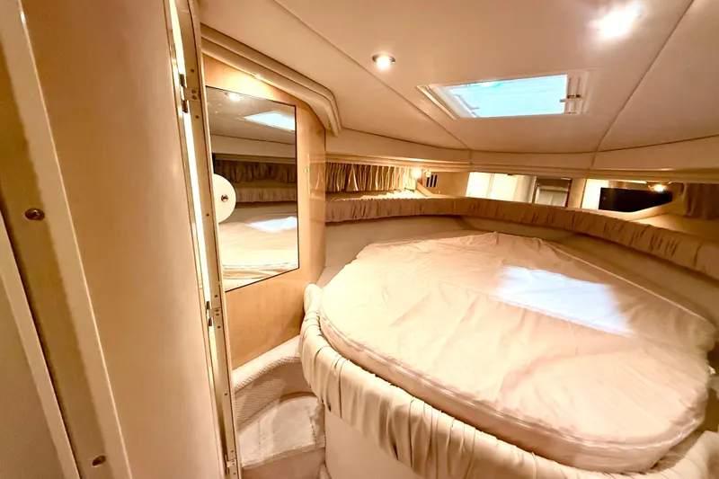 No Tan Lines Yacht Photos Pics Luxurious cabin interior of 2000 Sea Ray 410 Sundancer yacht with cozy bedding.