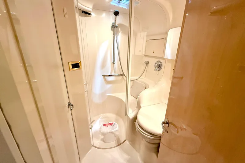 No Tan Lines Yacht Photos Pics Luxurious bathroom in 2000 Sea Ray 410 Sundancer yacht with shower and toilet.