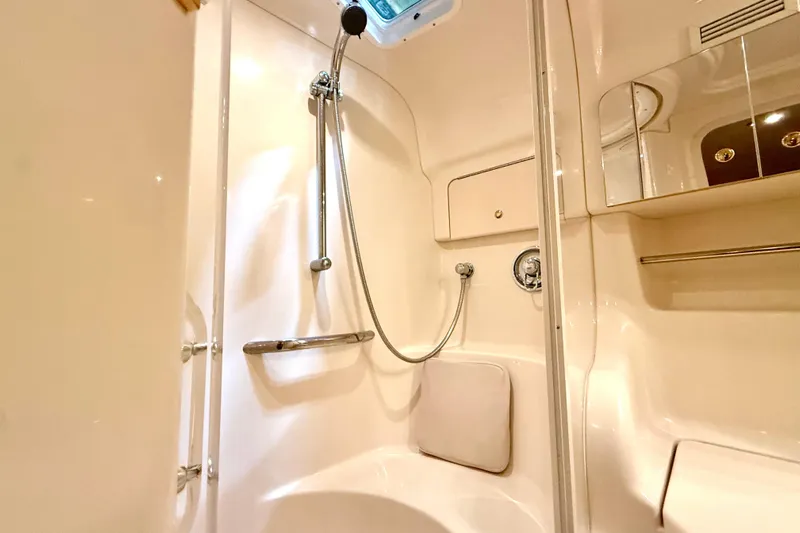 No Tan Lines Yacht Photos Pics Luxurious bathroom in 2000 Sea Ray 410 Sundancer yacht with shower and storage.