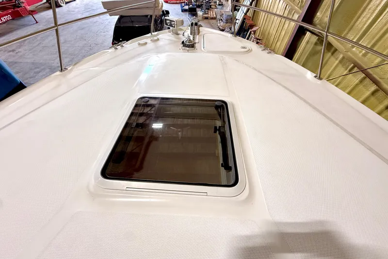 No Tan Lines Yacht Photos Pics 2000 Sea Ray 410 Sundancer boat deck with hatch, in a storage facility.