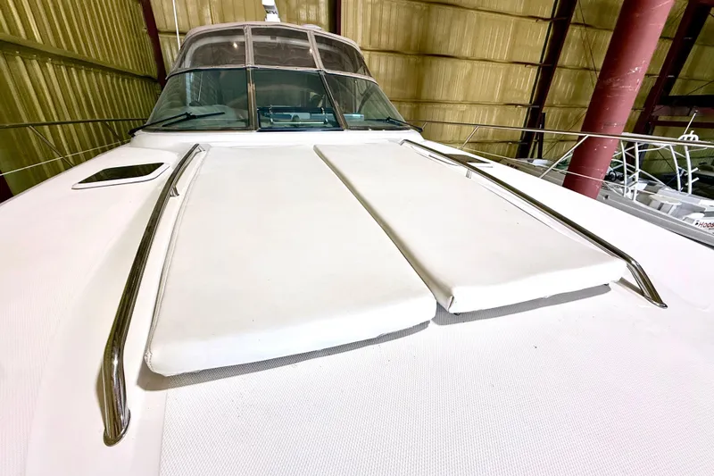 No Tan Lines Yacht Photos Pics 2000 Sea Ray 410 Sundancer yacht in storage, showcasing sleek deck design.