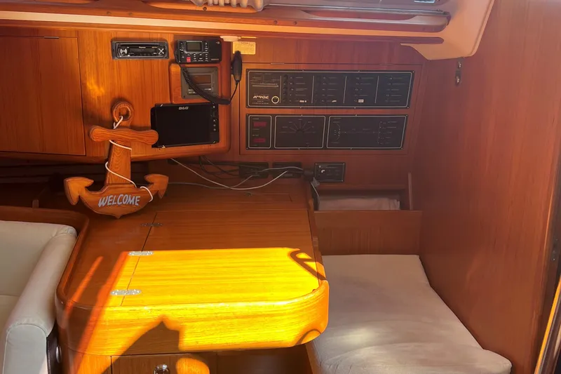 St. Francis Yacht Photos Pics Interior of 2001 X-Yachts 482 Modern, featuring wooden paneling and navigation equipment.