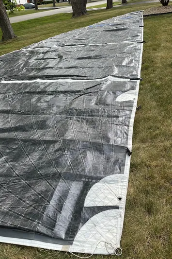 St. Francis Yacht Photos Pics Sail from a 2001 X-Yachts 482 Modern yacht laid out on grass.