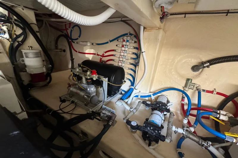  Yacht Photos Pics Engine room of 2016 Tiara Yachts C44 Coupe with complex wiring and machinery.