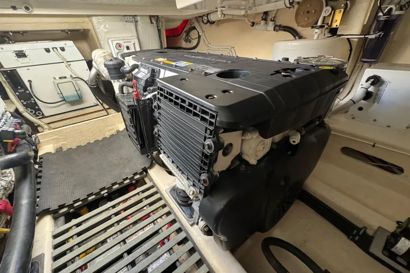 Yacht Photos Pics Engine room of 2016 Tiara Yachts C44 Coupe, showcasing detailed mechanical components.