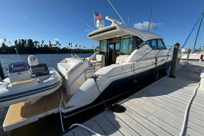  Yacht Photos Pics 2016 Tiara Yachts C44 Coupe docked, featuring sleek design and luxury amenities.