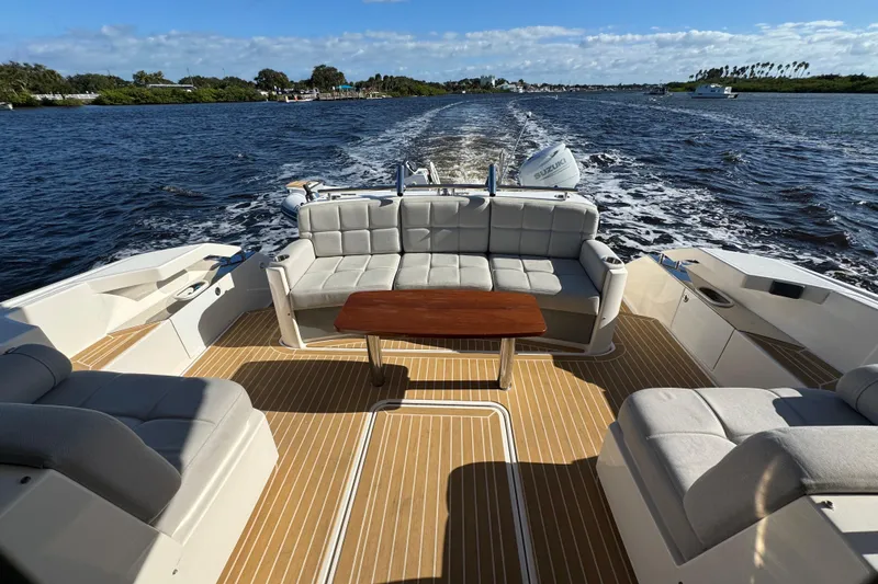  Yacht Photos Pics 2016 Tiara Yachts C44 Coupe with spacious deck seating on open water.