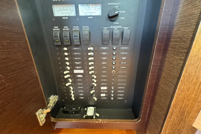  Yacht Photos Pics Electrical panel of a 2016 Tiara Yachts C44 Coupe, featuring switches and meters.