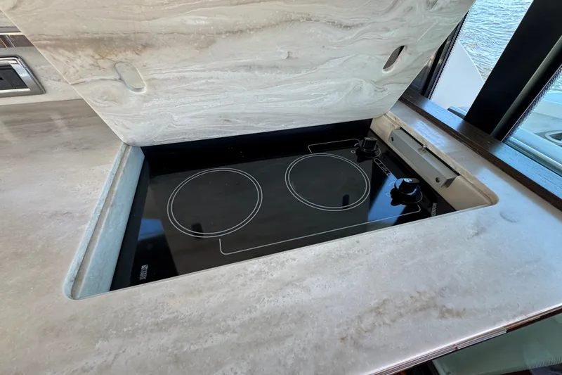  Yacht Photos Pics Modern stovetop on 2016 Tiara Yachts C44 Coupe, featuring sleek design and functionality.