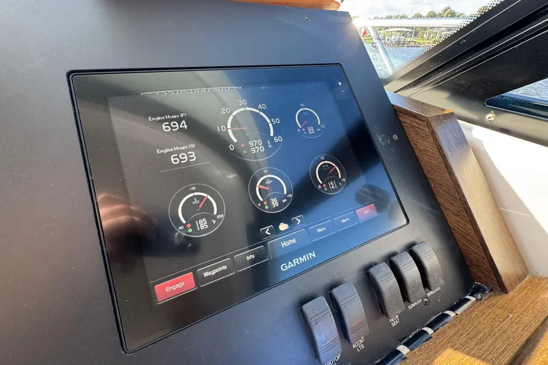  Yacht Photos Pics Dashboard of 2016 Tiara Yachts C44 Coupe with Garmin display showing engine data.