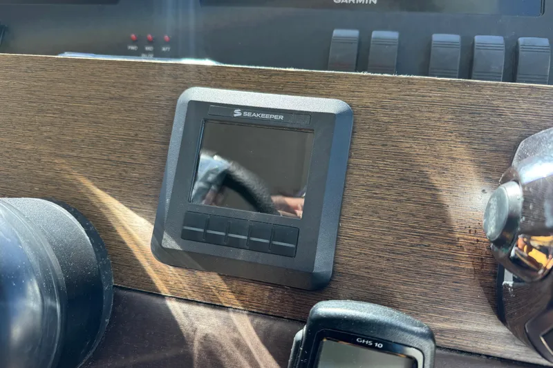  Yacht Photos Pics Seakeeper control panel on 2016 Tiara Yachts C44 Coupe dashboard.