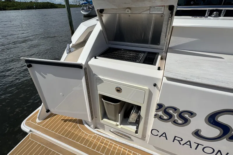  Yacht Photos Pics 2016 Tiara Yachts C44 Coupe outdoor kitchen with grill and storage.