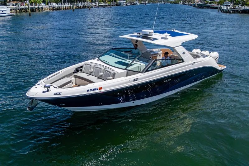  Yacht Photos Pics 2020 Sea Ray SLX 400 boat cruising on a sunny day in a scenic waterway.