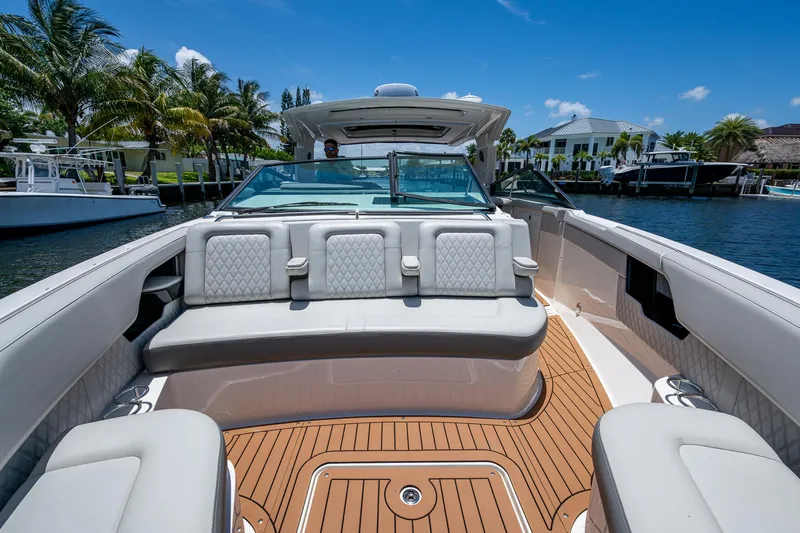  Yacht Photos Pics Luxurious 2020 Sea Ray SLX 400 boat with spacious seating and elegant design on a sunny day.
