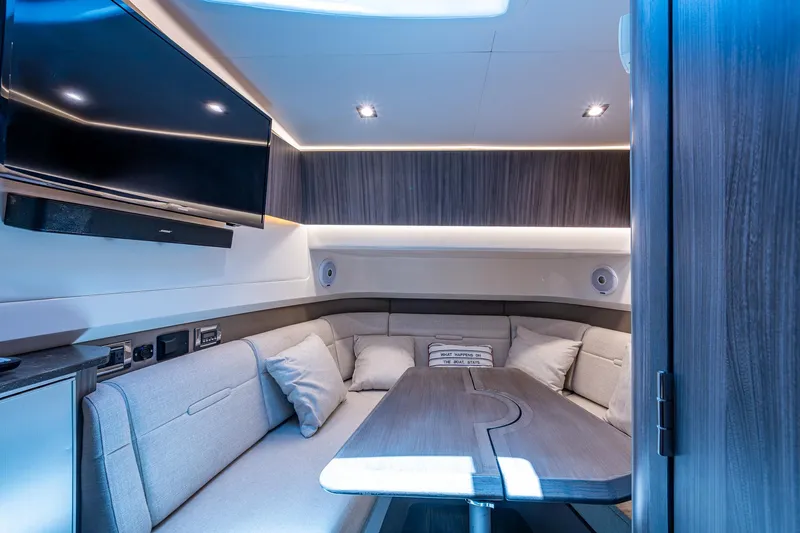  Yacht Photos Pics Luxurious interior of 2020 Sea Ray SLX 400 yacht with modern seating and entertainment system.