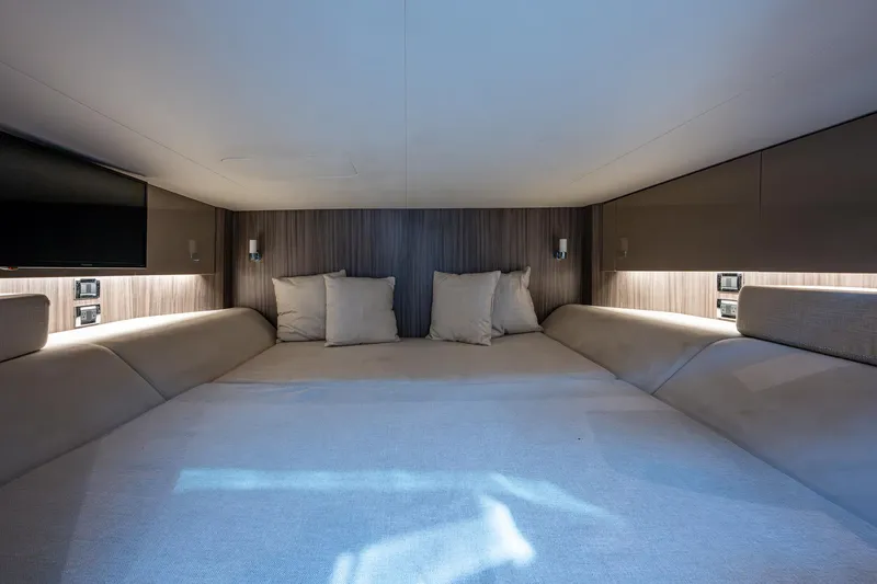  Yacht Photos Pics Interior cabin of 2020 Sea Ray SLX 400 yacht with cozy bedding and ambient lighting.